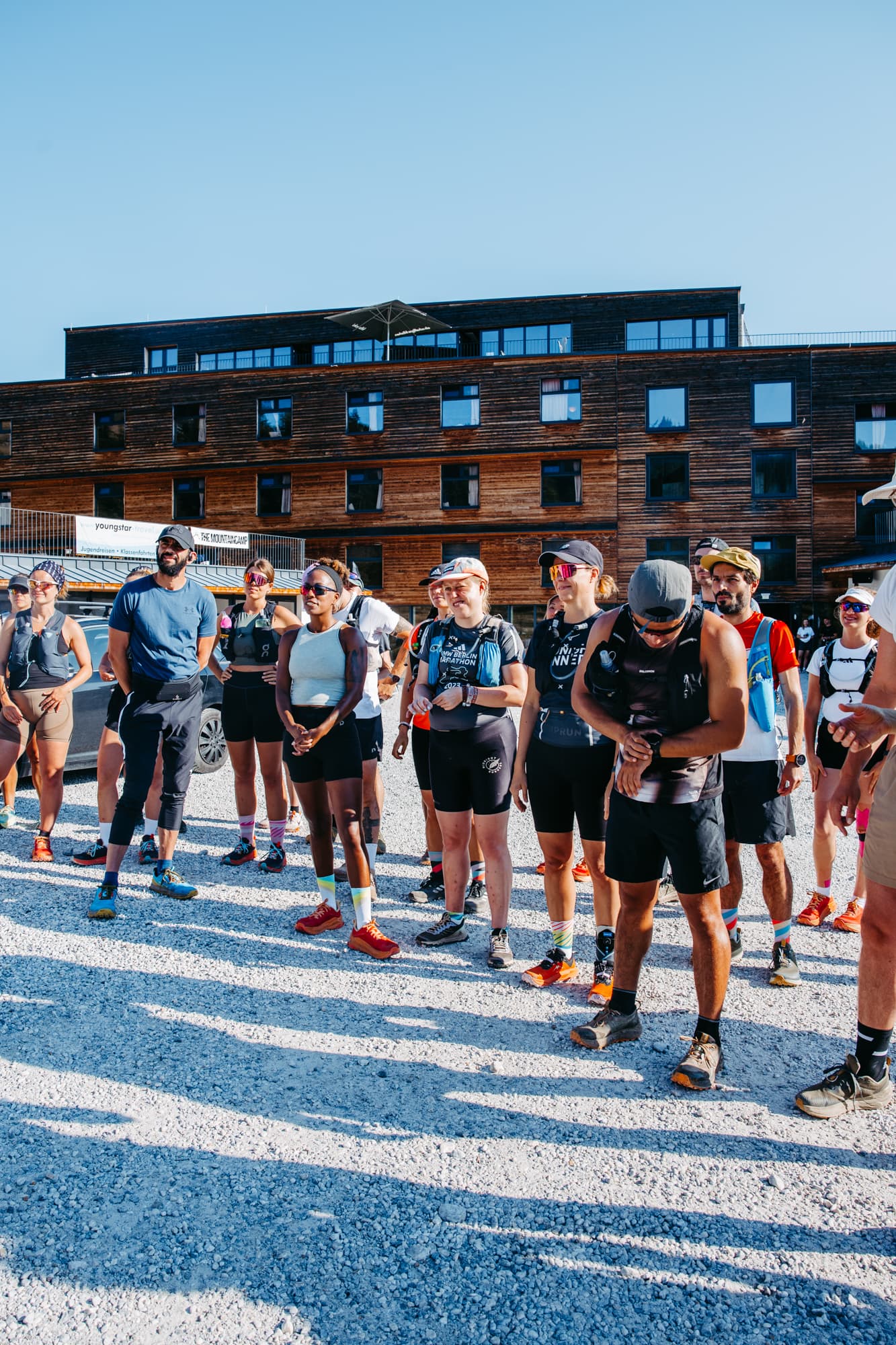 Group of runners gathered at mountain lodge