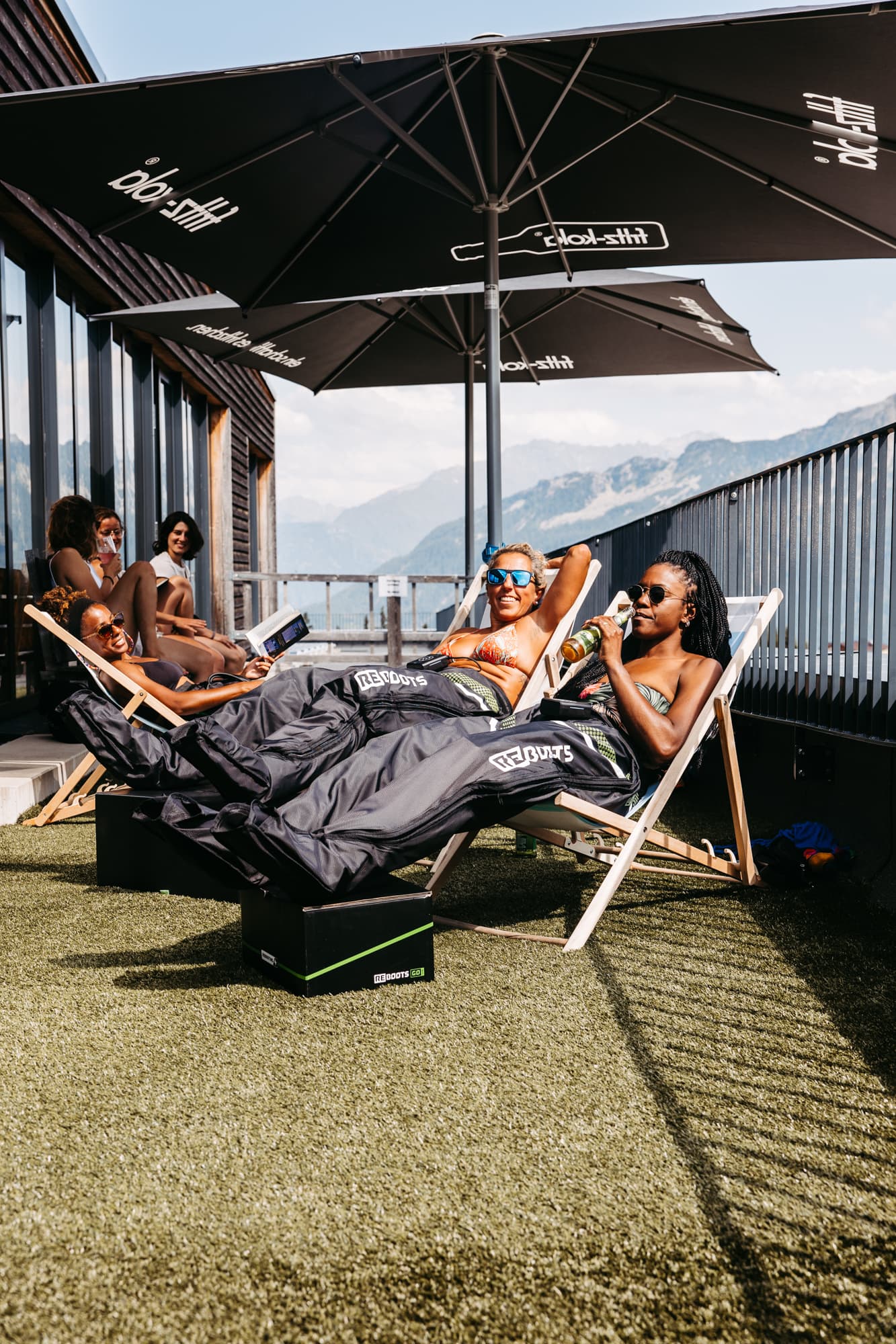 Campers relaxing on lodge terrace