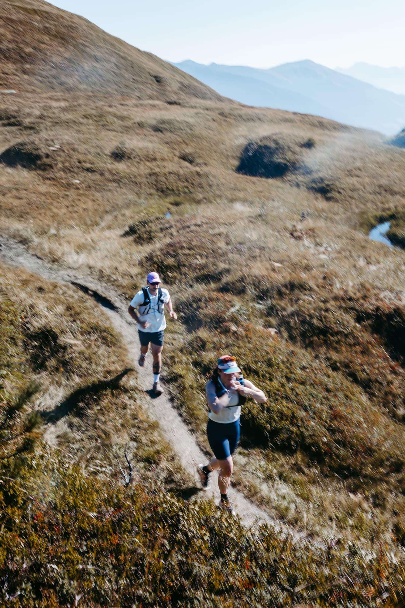 Aerial view of runners on mountain trail